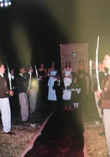  Homecoming Queen, Meghan Markle (centre left blue dress) prepares to walk the red carpet on the football field, flanked by St Francis students acting as knights and holding swords