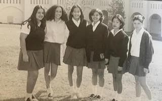  Meghan Markle (second from left) and friends pose for a shot as school reps at Immaculate Heart High School in Los Angeles circa 1997