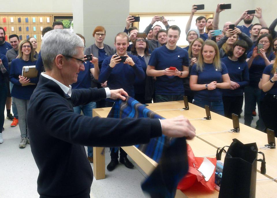  Cook shows off his new scarf, which should keep him warm in the chilly Scottish winter