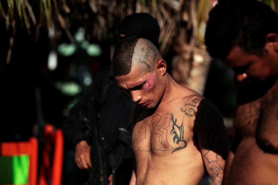  Many gang members are covered in tattoos displaying their loyalty to the international crime gang - this man's chest says XV3