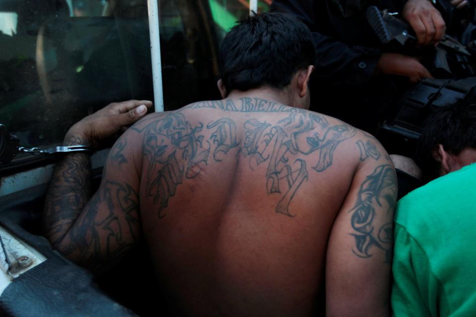  Elaborate tattoos, often including the number 18, make it easy to identify which of Central America's two powerful gangs a suspect belongs to