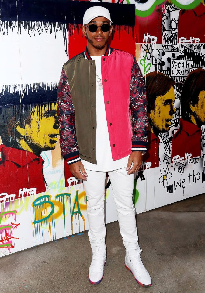  Lewis wore a striking sports jacket to the event