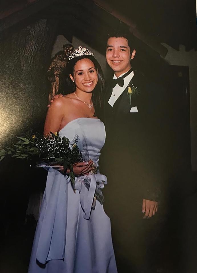  Meghan smiles for the camera with prom date Danny Segura in 1998