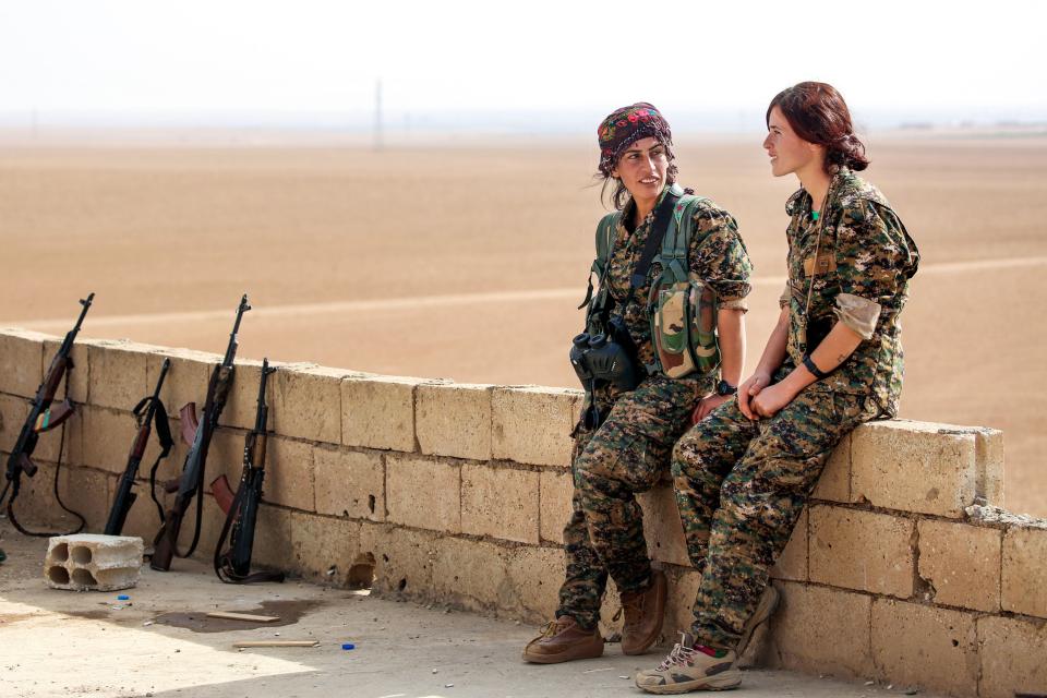  Two Kurdish female fighters who are bravely battling the warped ISIS group