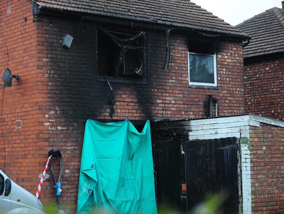  Extensive damage can be seen at the house after a blaze ripped through it