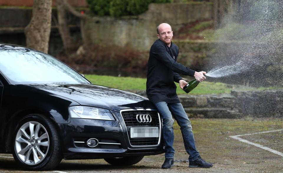  Andrew Nabb, with an Audi A3, breaks open the Champers after his EuroMillions win