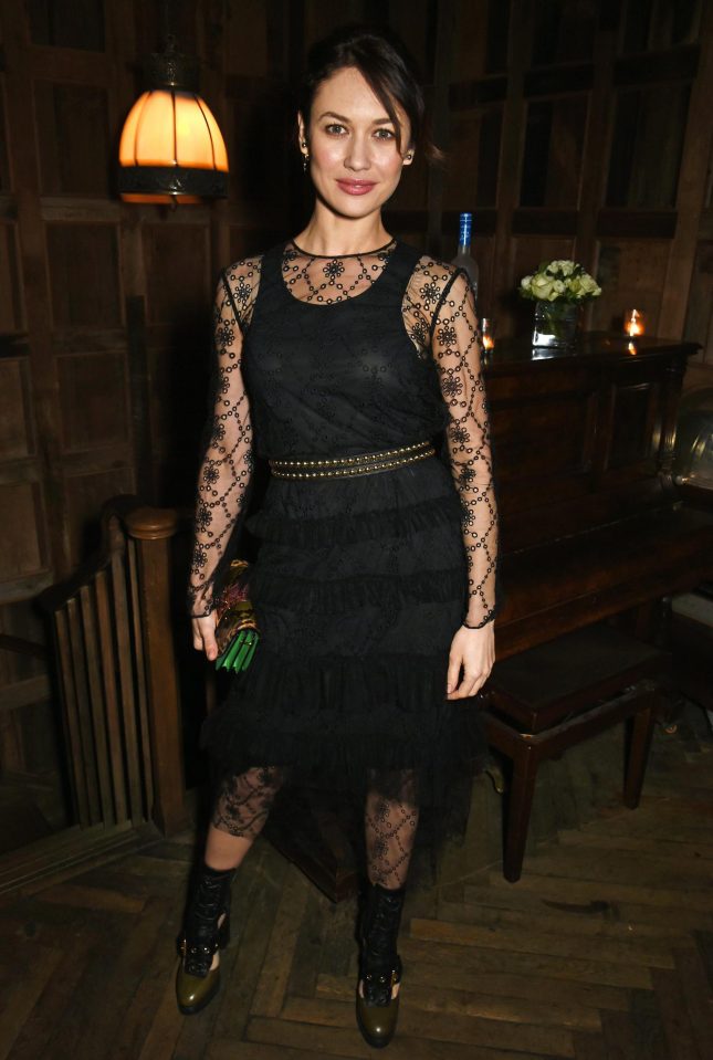  Bond girl Olga Kurylenko looked elegant in a black lace dress