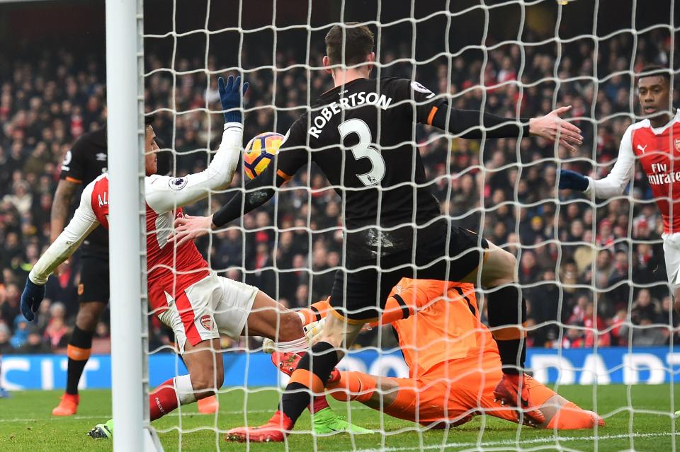  The Chilean then bundles the ball in with his hand to give Arsenal the winner