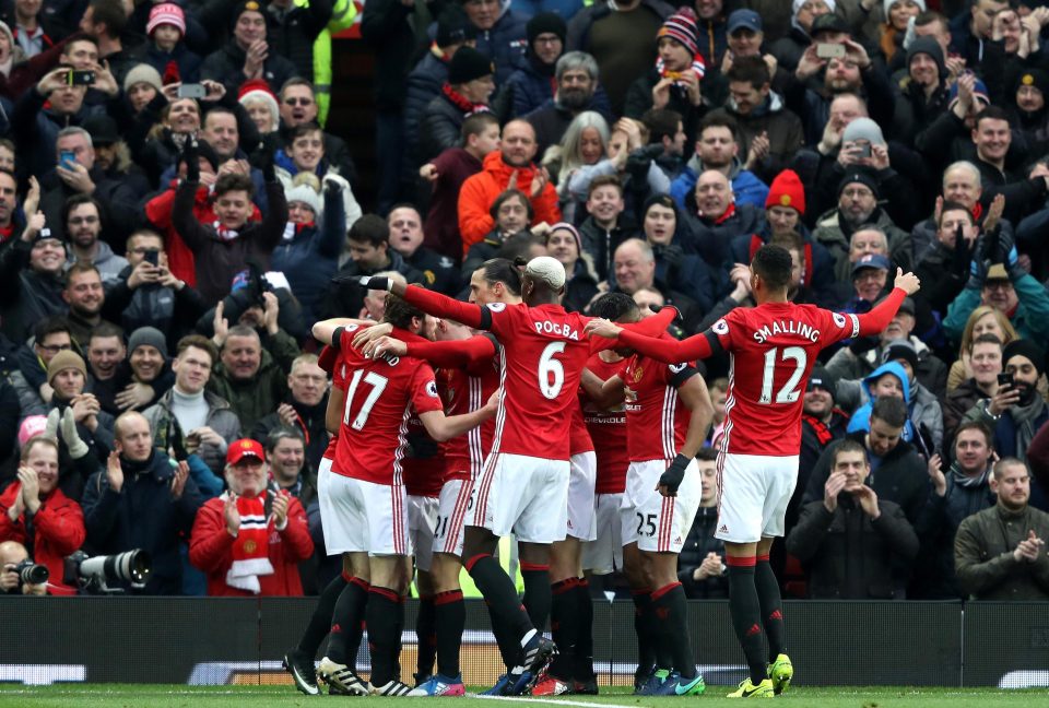  The Manchester United players then gather around Mata to celebrate going into the lead against Watford