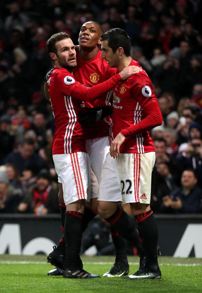  Martial is congratulated for scoring and giving his team some breathing space at Old Trafford