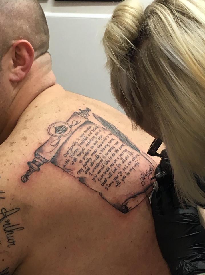  Father of three Kevin Sheridan get a tattoo inked to his back as a way of proposing to girlfriend Jo Holmes