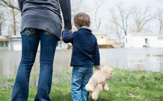 A mum who allowed her two young boys to sleep in the same bed as her has had them removed from her care