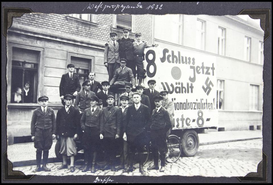  An early meeting of SS members beside a propaganda truck