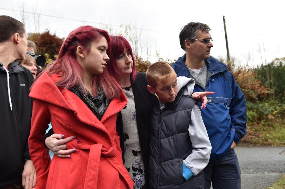  Jazmin and her family including mum Coral, dad Paul and brother Harley watching as Mark Bridger's house was razed to the ground