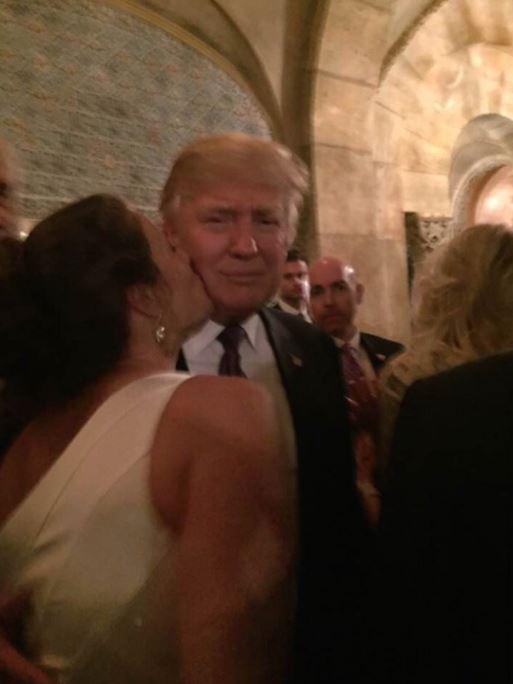  A diner leans in to kiss Trump on the cheek at the Mar-a-Lago in Palm Beach