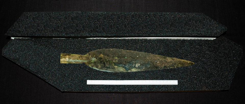  A Bronze age Spear head being examined in the lab after being discovered at a site in Carnoustie, Angus, Scotland