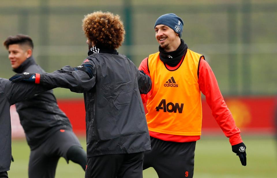 Zlatan Ibrahimovic and Marouane Fellaini stretch their legs in Manchester United training