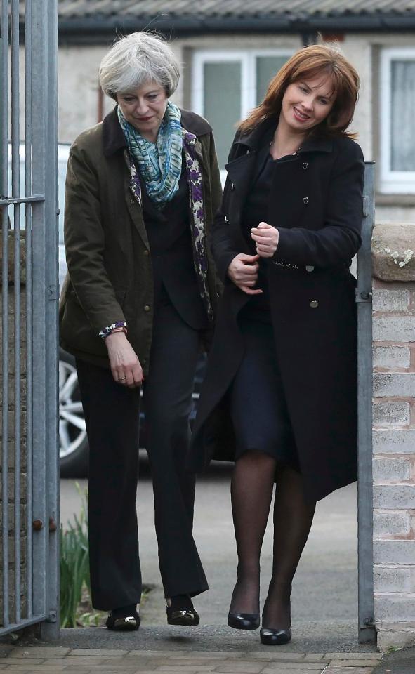  Mrs May nearly came a cropper as she and Tory by-election candidate Trudy Harrison tried to squeeze through the school gate at the same time