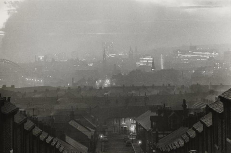  'Carville Road at night, 1969'. Coal fires smoking against the Tyne Bridge and the City of Newcastle