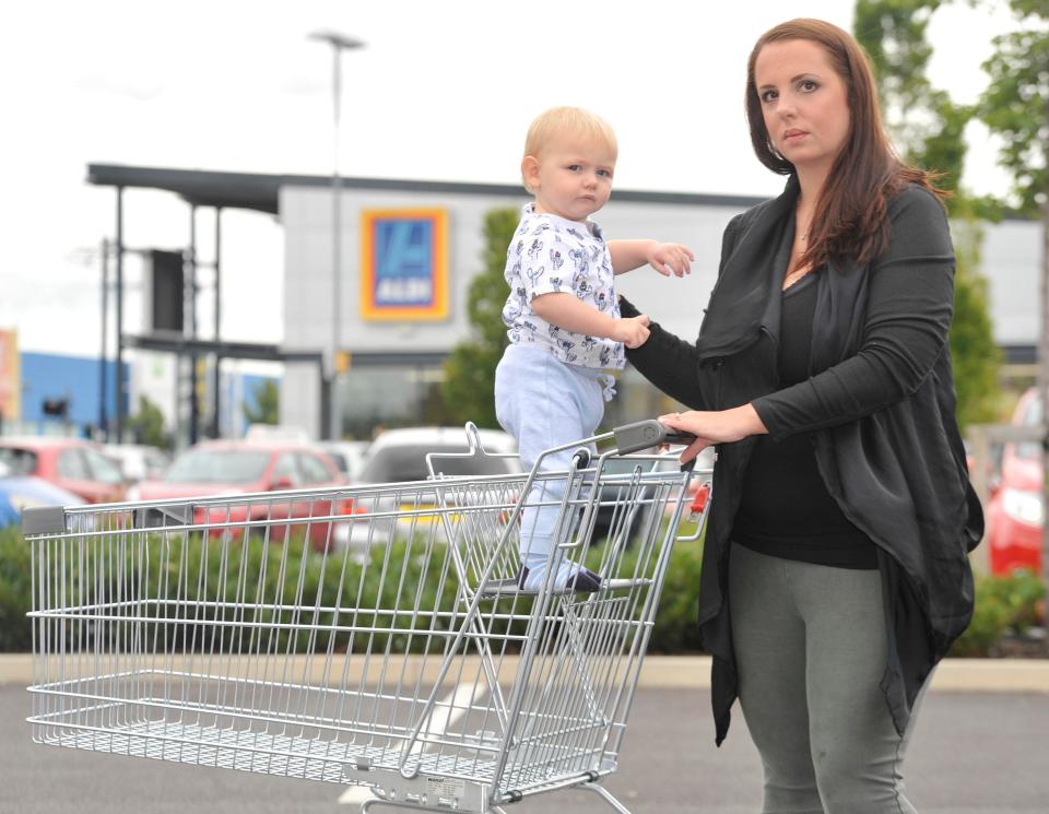  Jodie Shawcross from Ashton under Lyne, Manchester, with her son Stanley and the children's seat of an Aldi trolley which she has successfully campaigned to change