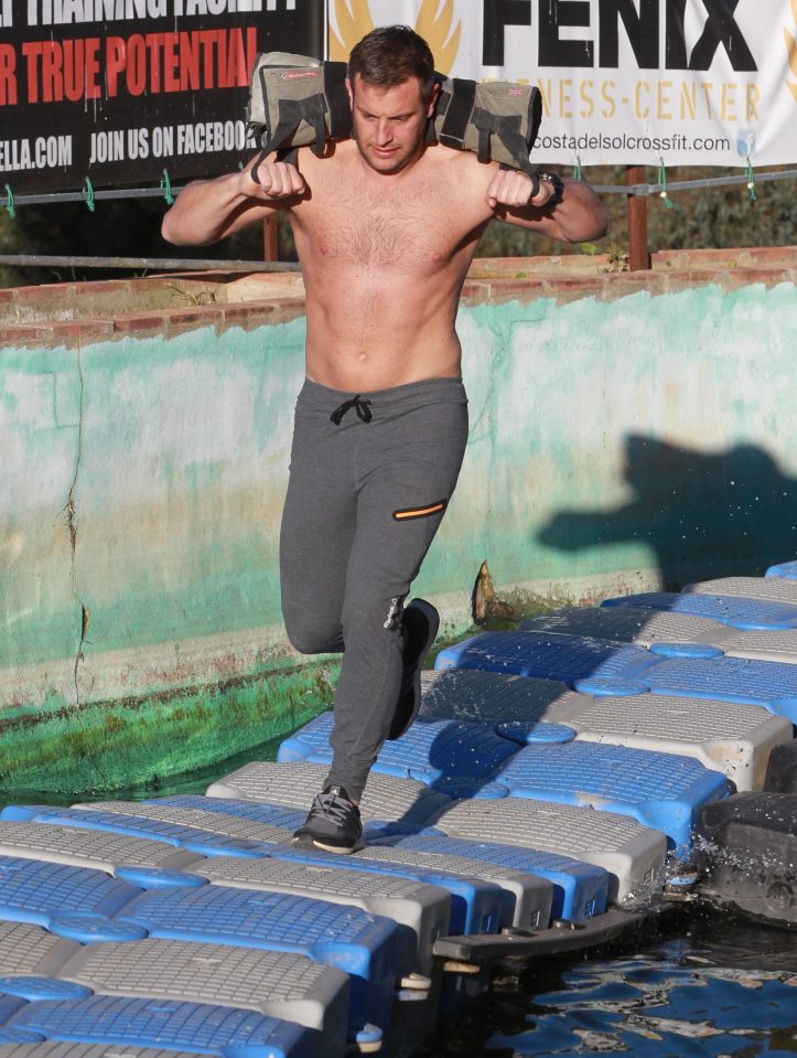  He ran across a plastic bridge carrying a sandbag - and made it look easy