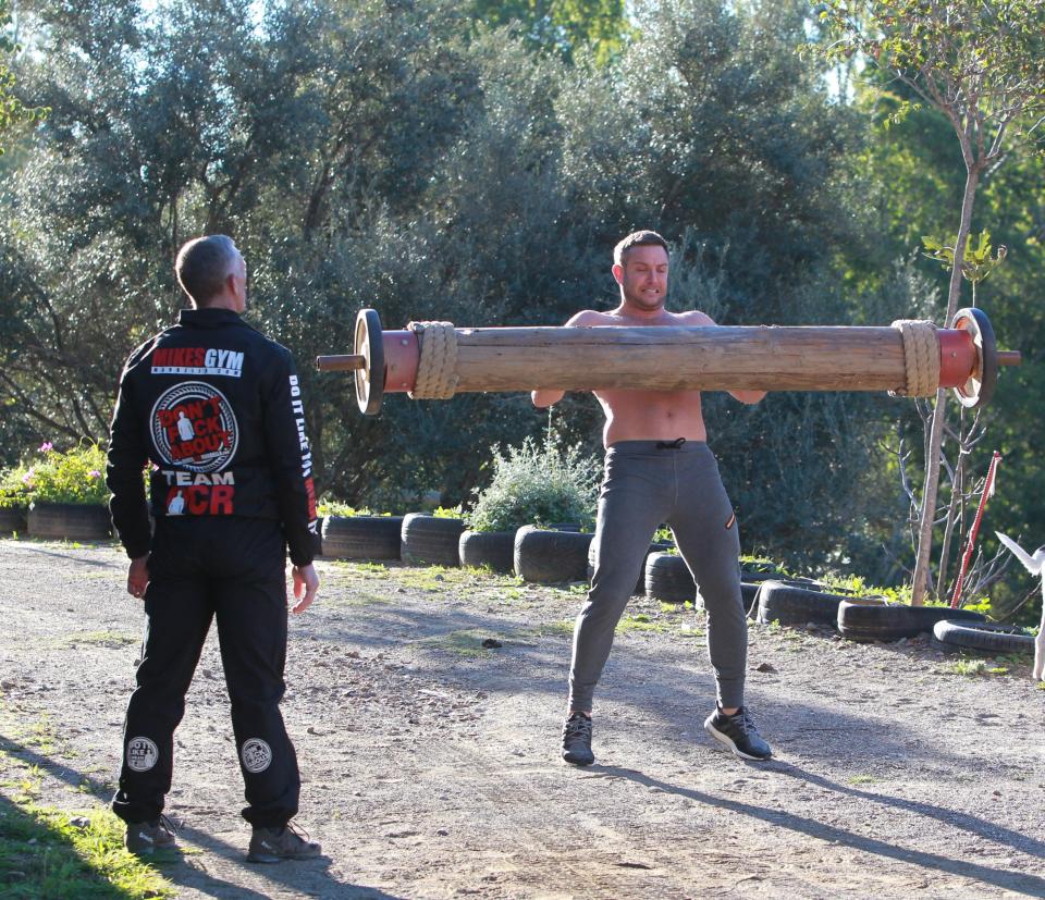  Elliott grimaced as he lifted the log to chest level