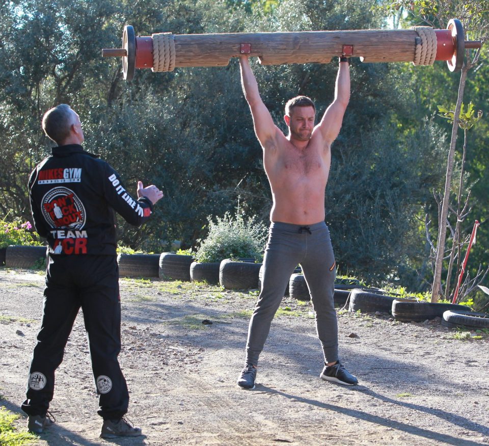  The former Towie star lifted a huge piece of wood, showing off his muscular torso