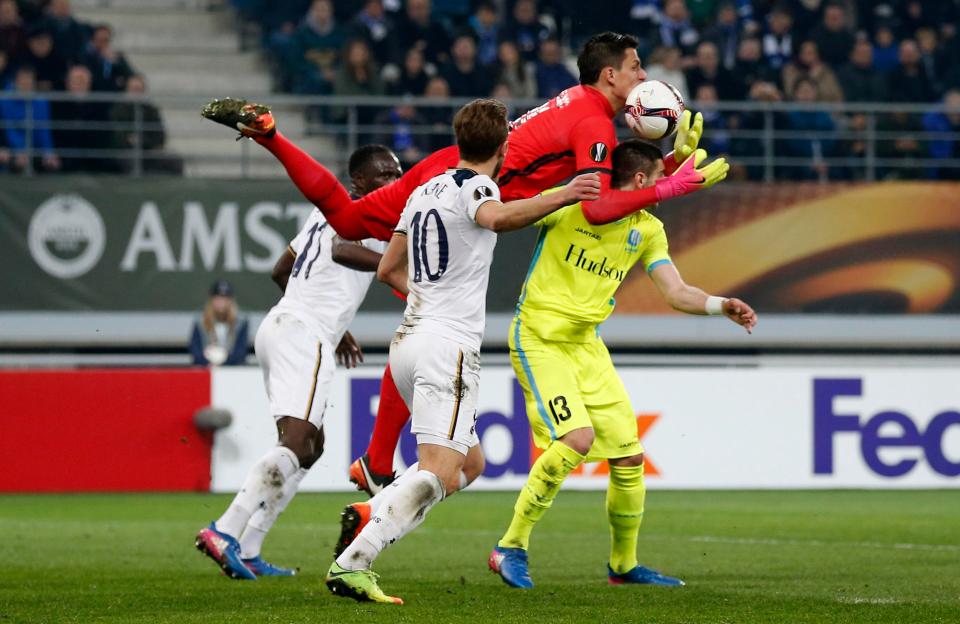  Gent keeper Lovre Kalinic leaped through the claim the ball