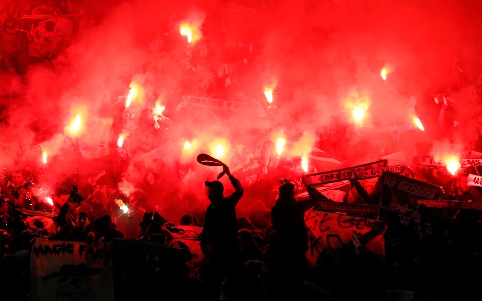  St Etienne fans raised their flags amongst the flares