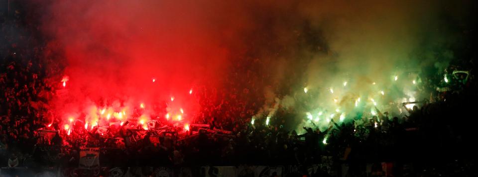  One set of fans had red flares, whilst another had green flares