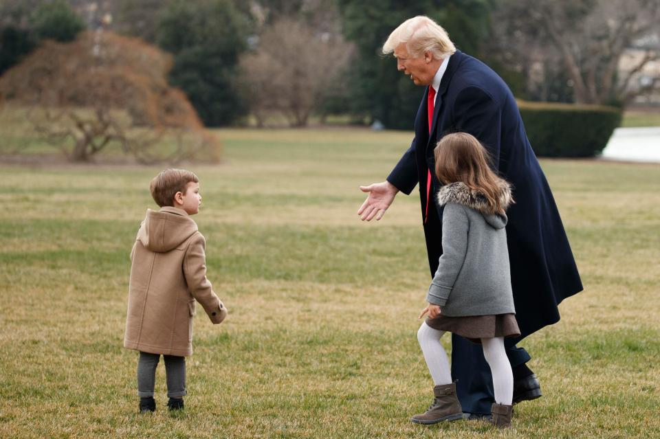  The youngsters larked about with Trump before he walked them to Marine One