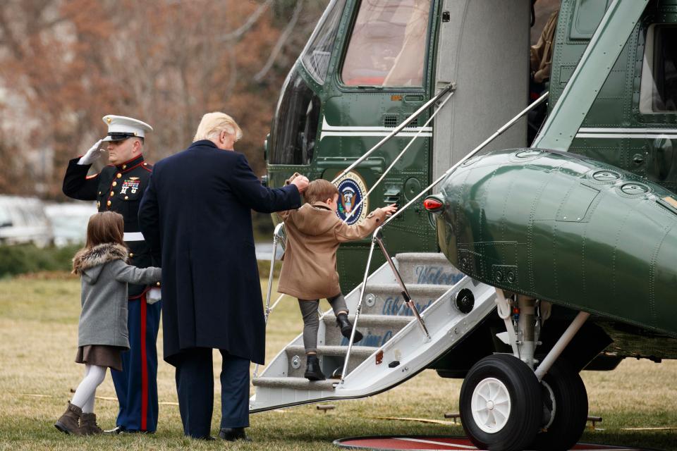  Trump was seen helping little Joseph, three, climb aboard Marine One