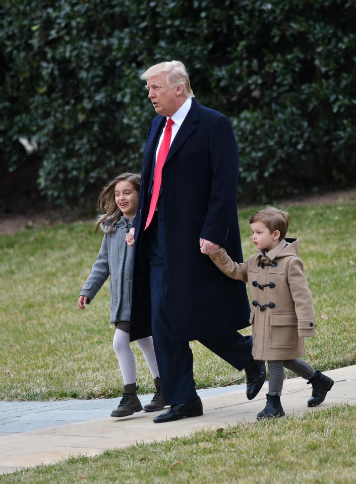  The youngsters smiled as they walked alongside President Trump in the grounds of the White House