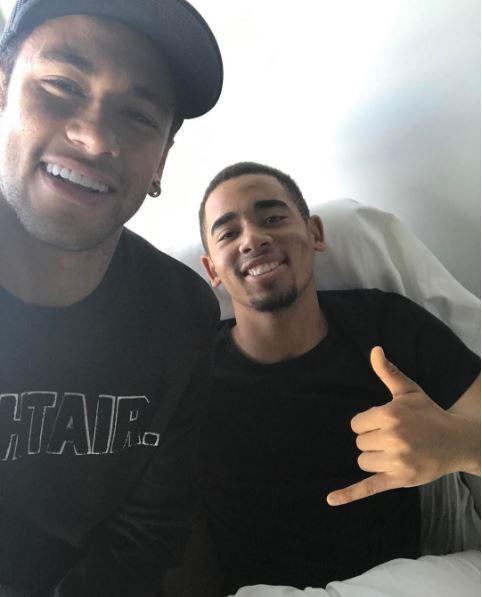 Neymar and Jesus were all smiles as they posed for a photo at the Brazilian's bedside