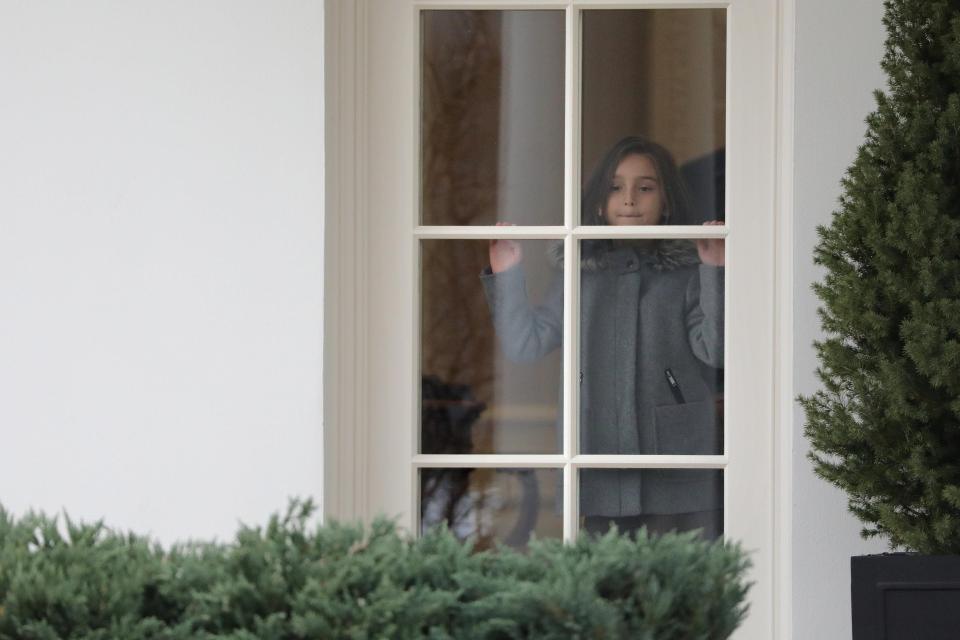  Arabella gazes out of the windows of the Oval Office in the White House, Washington