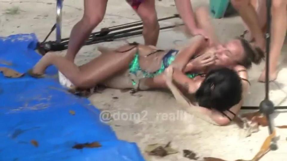  The contestants, who were both wearing glamorous swimming costumes, were filmed violently pulling each other’s hair