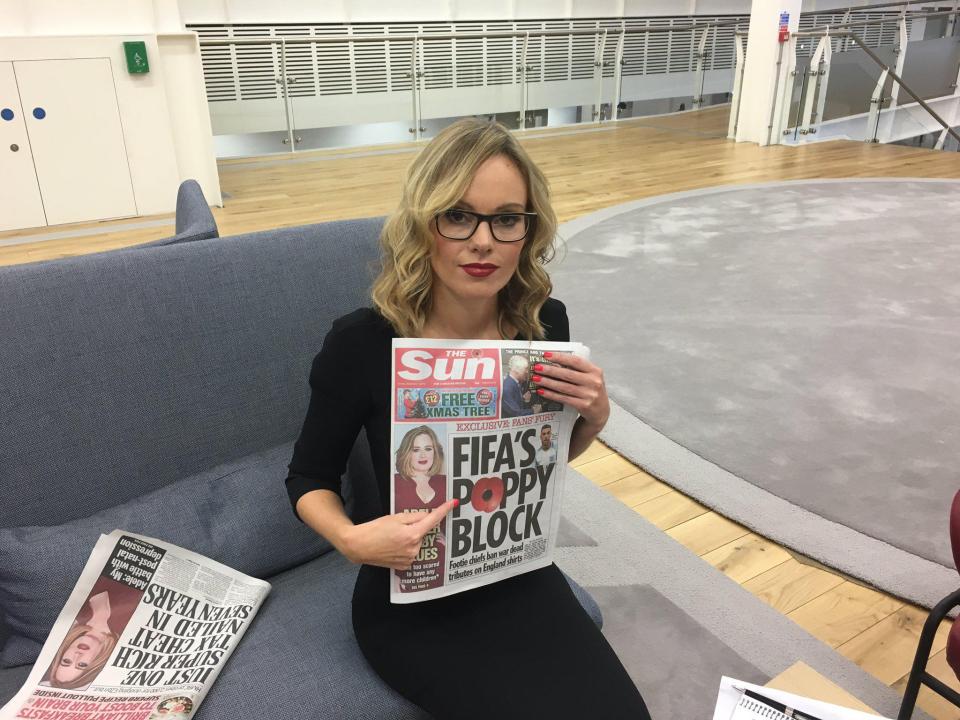  Michelle Dewberry posing with The Sun's front page about the outrageous poppy block