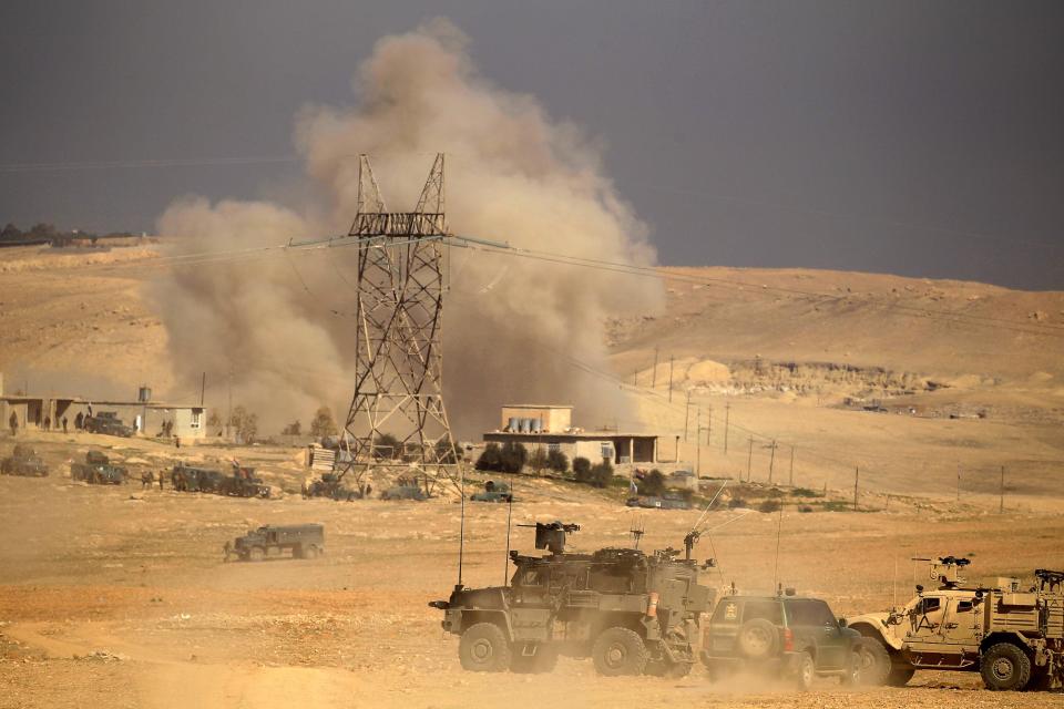  Smoke rises next to a position held by the Iraqi rapid response forces during a battle against ISIS south of Mosul