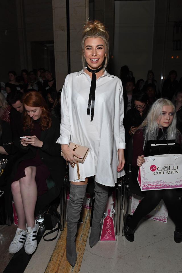  Olivia Buckland looked glam and casual in an oversized shirt dress with thigh high boots