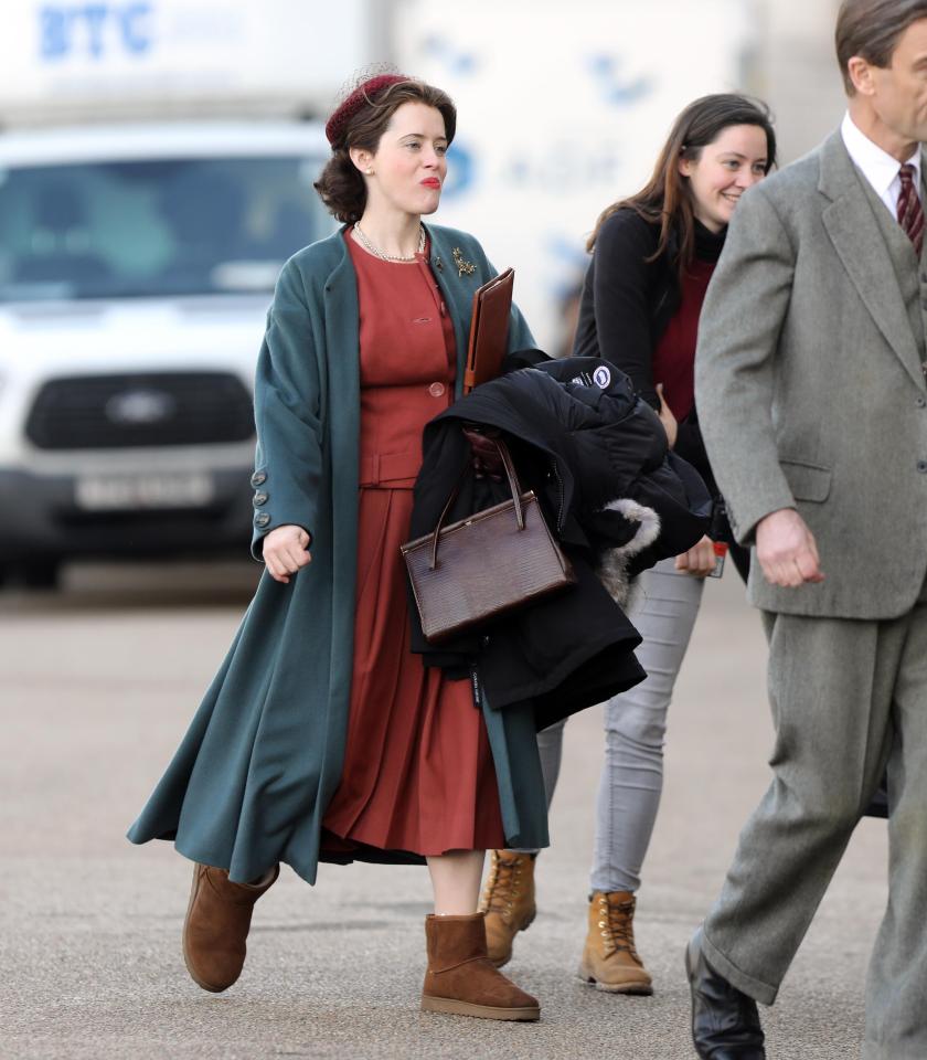  Claire wrapped up warm in a long teal jacket over her red dress