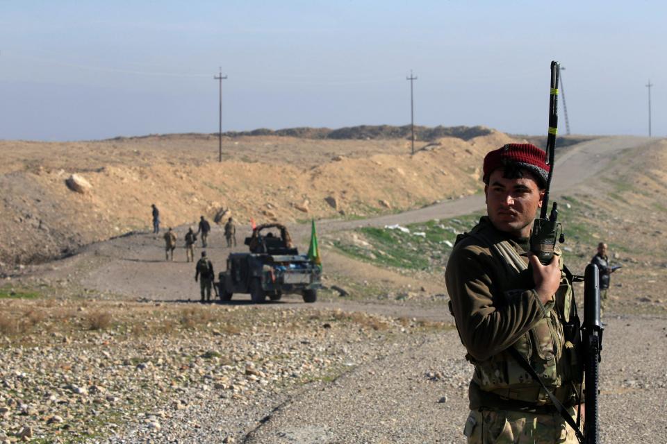  A member of the Iraqi rapid response forces takes part in an operation against Islamic State