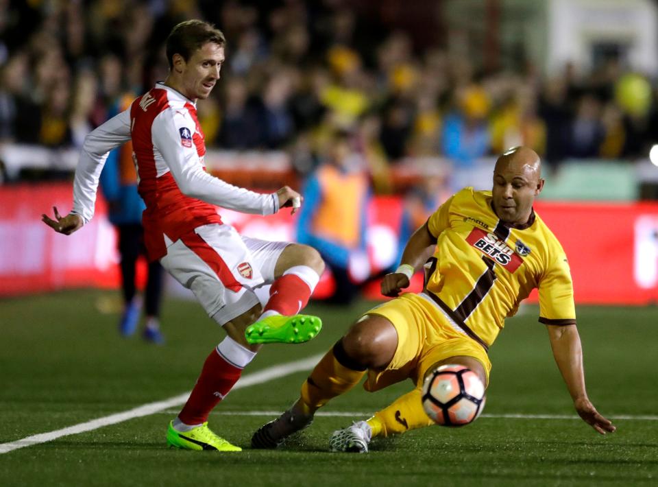  Simon Downer in action for Sutton against Arsenal's Nacho Monreal