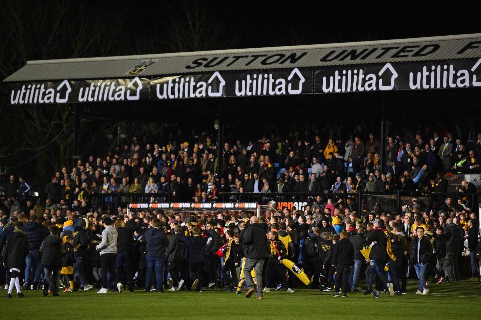 Fans crowd near the tunnel as the try to get close to Arsenals stars