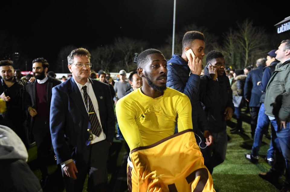  Sutton stars were swarmed by home supporters after the match