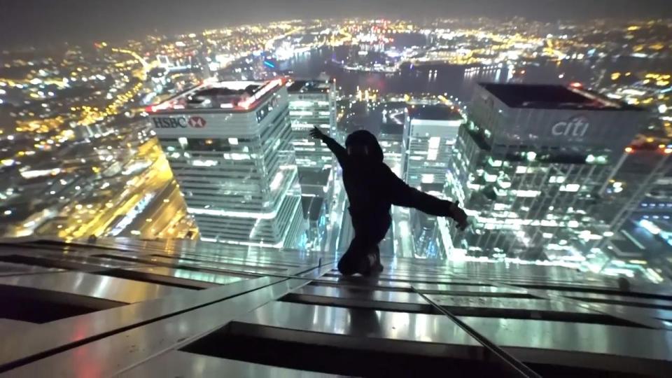 This is the moment two young men climb to the top of London's second highest building