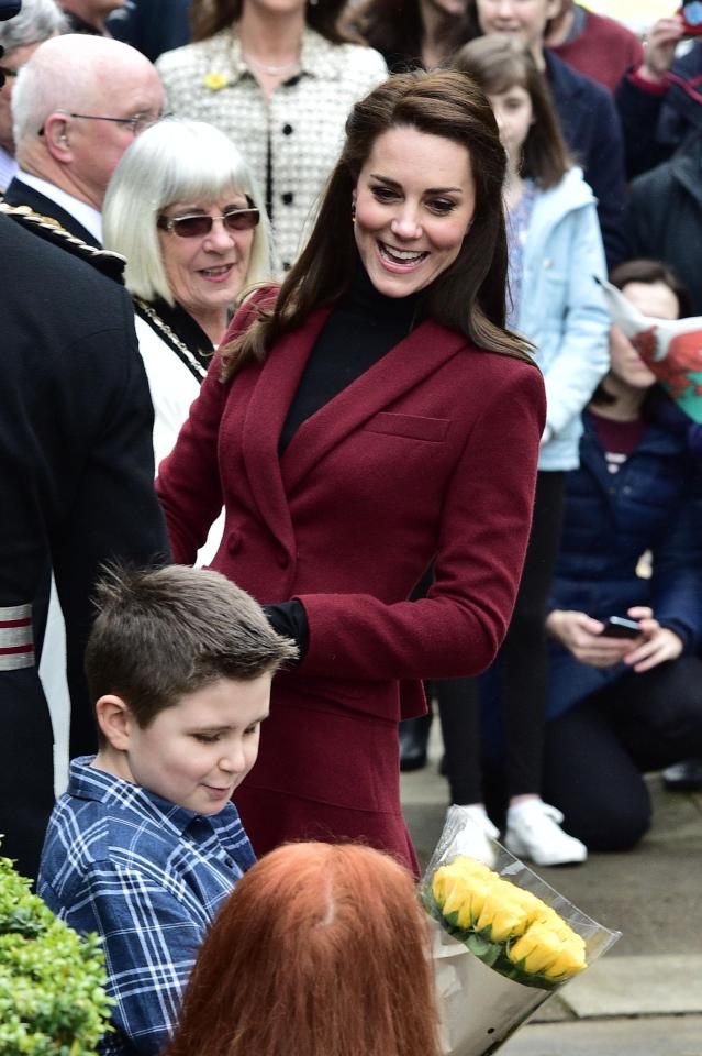  She was given flowers as she arrived at the children's centre in Wales