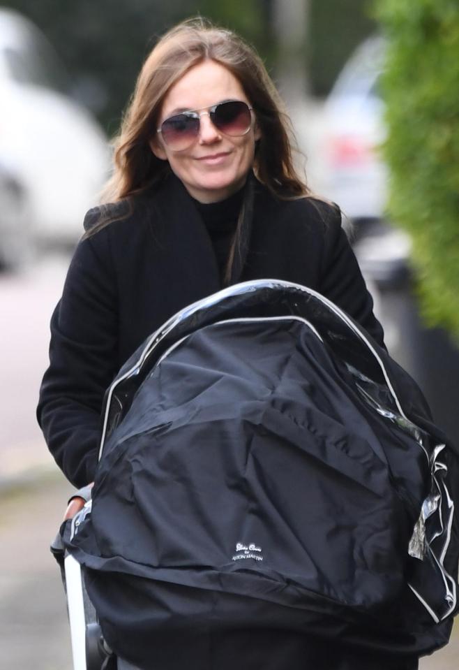  Geri Horner was all smiles as she headed out for a walk with son Monty on Wednesday