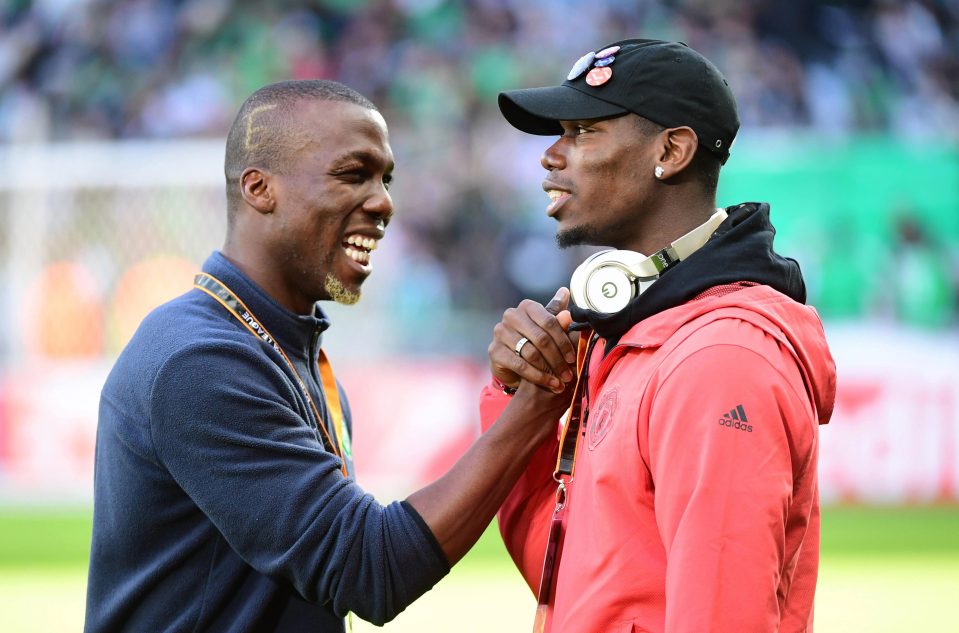  Paul Pogba shares a laugh with his brother Florentin before the game