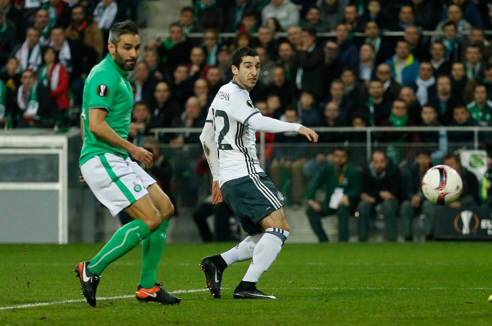  Henrikh Mkhitaryan pokes the ball past the keeper to settle the tie