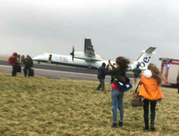  Shocked passengers took pictures of the plane after being evacuated at Schiphol Airport